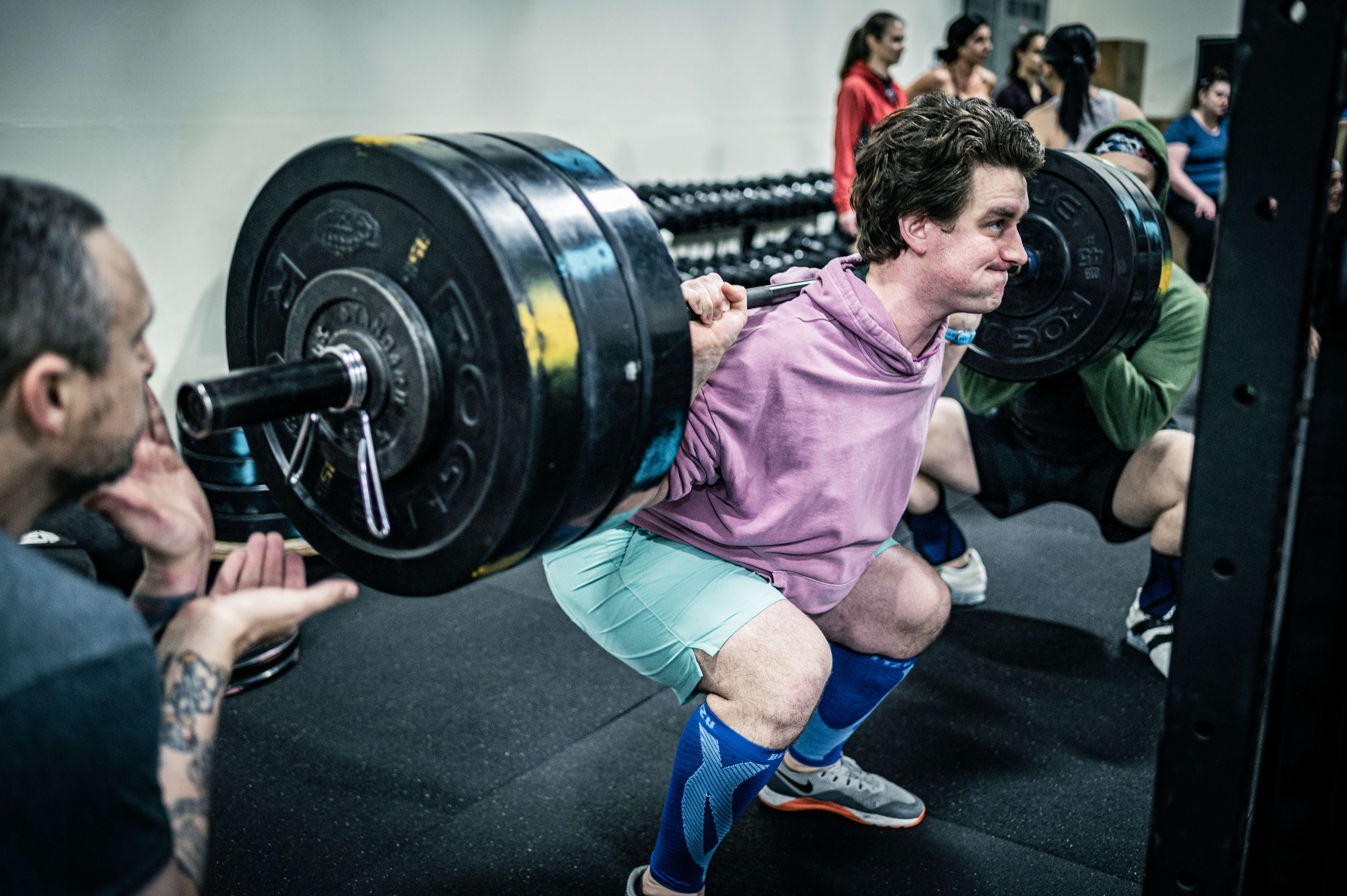 CrossFit Tigard athlete front squatting with intensity and determination