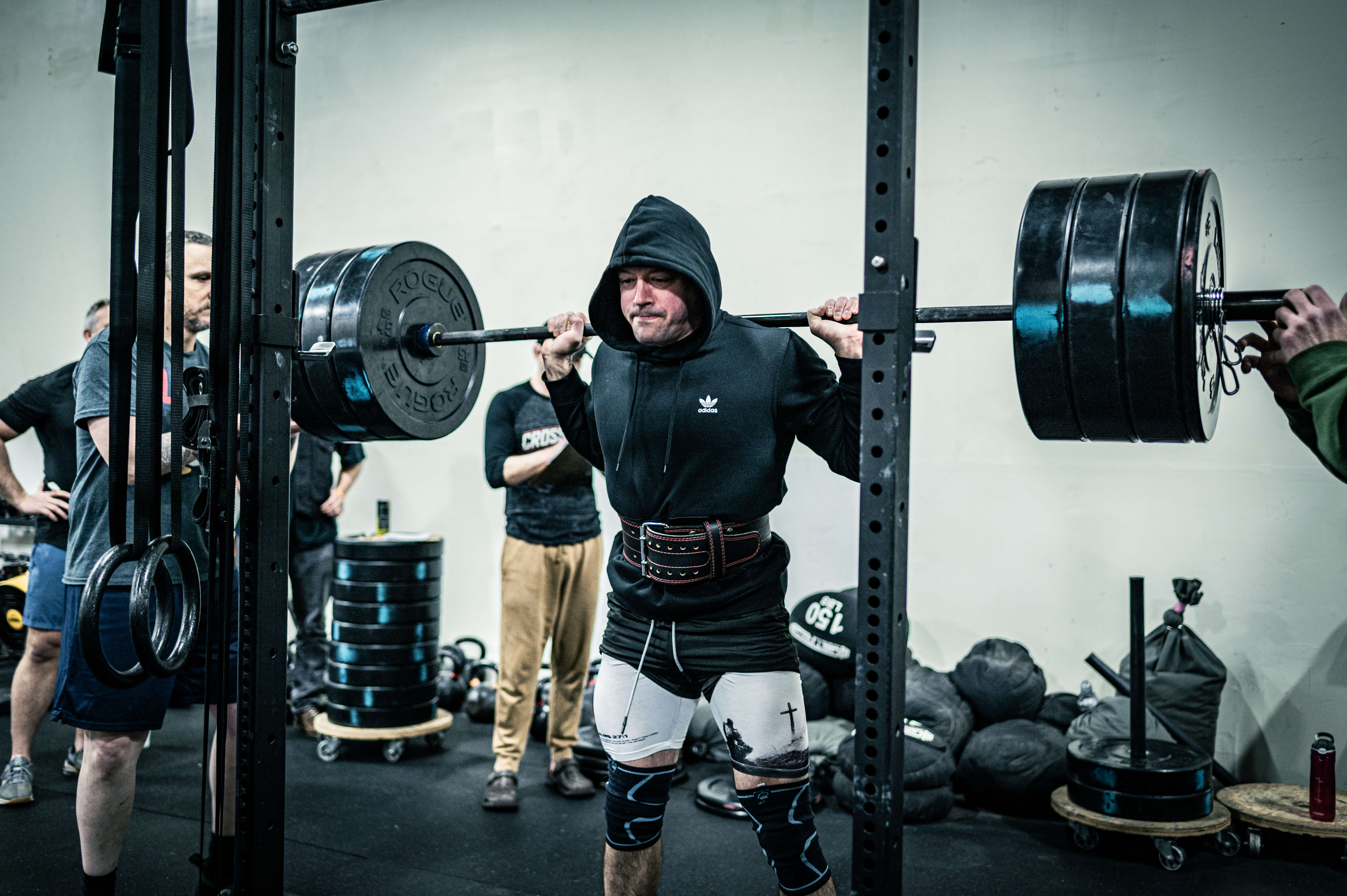 Athlete performing a heavy barbell back squat at CrossFit Tigard gym in Tigard, Oregon